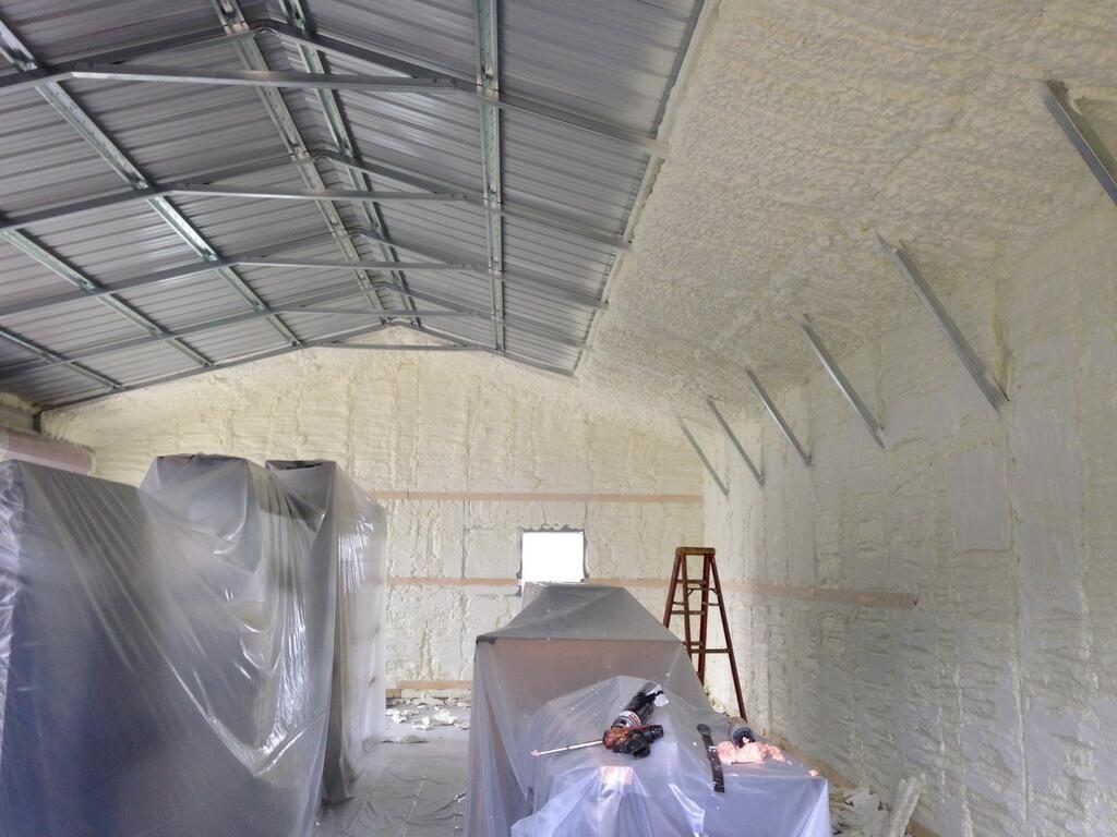 Spray foam insulation installed in a commercial metal building interior