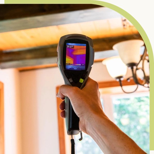 Thermal imaging camera showing heat loss in a home ceiling